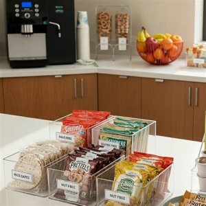 A wedding sandwich and wrap station with various bread, wraps, fillings like turkey and chicken, fresh vegetables, and condiments for guests to create their own meals.